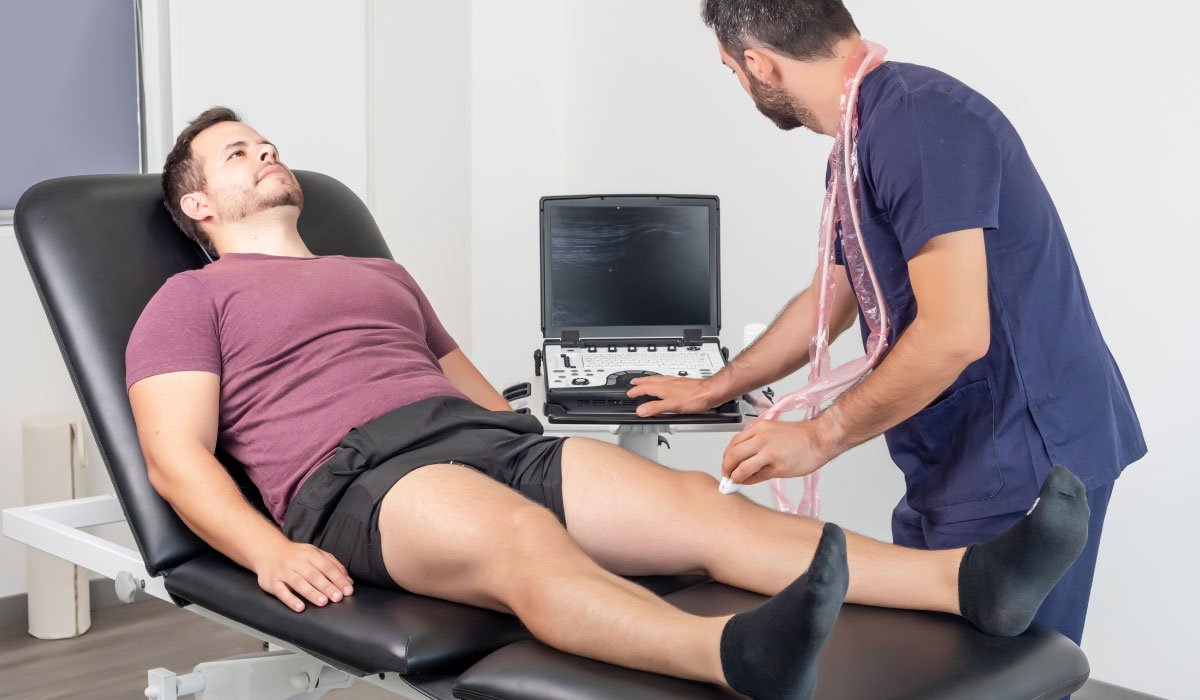 Man receiving ultrasound therapy treatment for pain relief.
